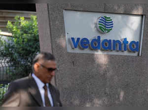 FILE PHOTO: A man walks past the logo of Vedanta outside its headquarters in Mumbai