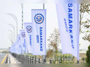 Flags fly by the road ahead of the SCO summit in Samarkand