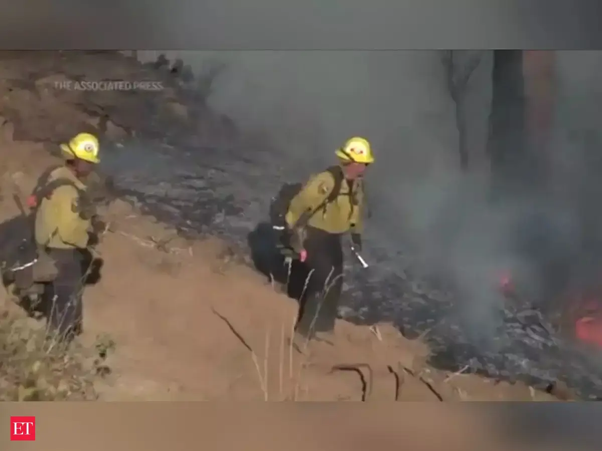 Watch: Flames jump river as California crews battle fire - The Economic ...