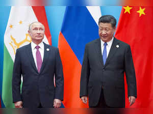 FILE - Chinese President Xi Jinping, right, and Russian President Vladimir Putin...