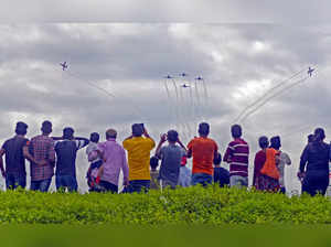 Bhubaneswar: Spectators watch IAF's Surya Kiran team flying Hawk MK-132 aircraft...