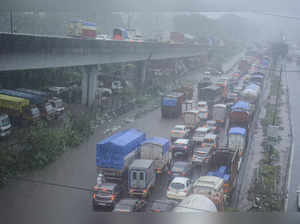 Thane: Vehicles move slowly during a traffic jam due to heavy rains in Thane. (P...