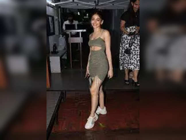 Alaya F turns heads with plunging neckline olive green dress