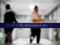 People walk past a barricade inside the Reserve Bank of India (RBI) headquarters in Mumbai