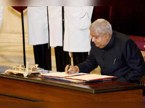 New Delhi, Aug 11 (ANI): Jagdeep Dhankar signs a register after taking oath as 1...