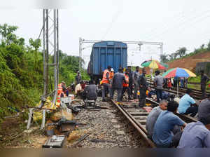 Railway officials at the spot after a goods train derailed he Kan...