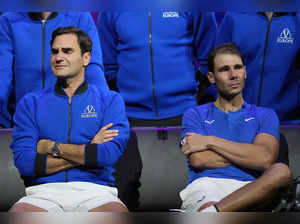 An emotional Roger Federer, left, of Team Europe sits alongside his playing part...