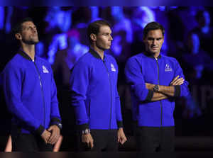 Team Europe's Novak Djokovic, Rafael Nadal and Roger Federer line up on the cour...