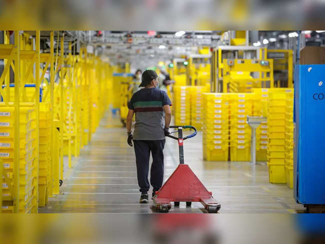 Amazon raises hourly pay for warehouse and transportation workers