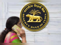 Mumbai: A woman walks past the Reserve Bank of India (RBI) headquarters, in Mumb...