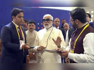 New Delhi, Oct 01 (ANI): Prime Minister Narendra Modi with Chairman of Reliance ...