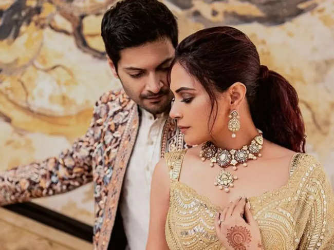 ​While Richa Chadha dazzled in a gold embellished saree, Ali Fazal looked dapper in heavily embroidered Sherwani.