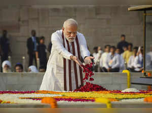 New Delhi: Prime Minister Narendra Modi pays homage to Mahatma Gandhi on the occ...