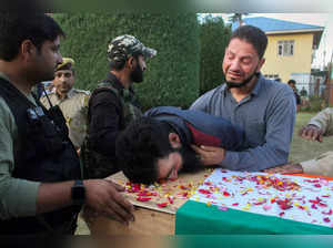Pulwama: Relatives mourn near the mortal remains of slain policeman Javid Ahmad ...