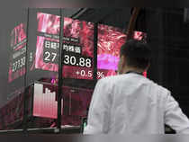 Japan's Nikkei hits two-week top amid jump in energy, chip shares