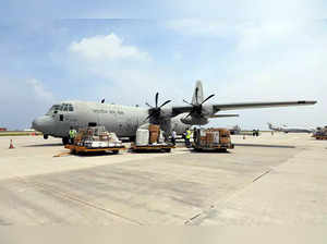 Male, Feb 15 (ANI): Crates being carried after unloading from a cargo plane as I...