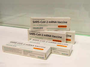 FILE PHOTO: Boxes of Walvax Biotechnology's mRNA COVID-19 vaccine are displayed at a trade fair in Shanghai