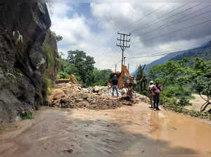 Darjeeling, June 20 (ANI): JCB machines clear the debris following the landslide...