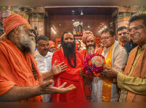 Haridwar: Uttarakhand Chief Minister Pushkar Singh Dhami with sadhus after the '...