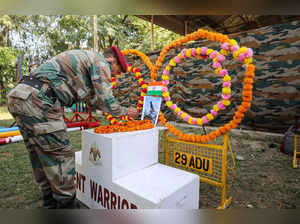 Jammu: An Army personnel pays tribute to its canine warrior 'Zoom', who succumbe...