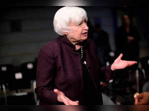 U.S. Treasury Secretary Janet Yellen talks with other attendees at the Annual Meetings of the International Monetary Fund and World Bank in Washington