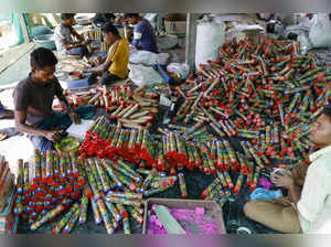 Ahmedabad: Workers make firecrackers at a workshop ahead of the upcoming Diwali ...