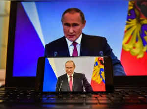 Photo taken on Sept. 30, 2022 shows screens displaying Russian President Vladimir Putin delivering a speech in Moscow, Russia. (Xinhua/Cao Yang/IANS)