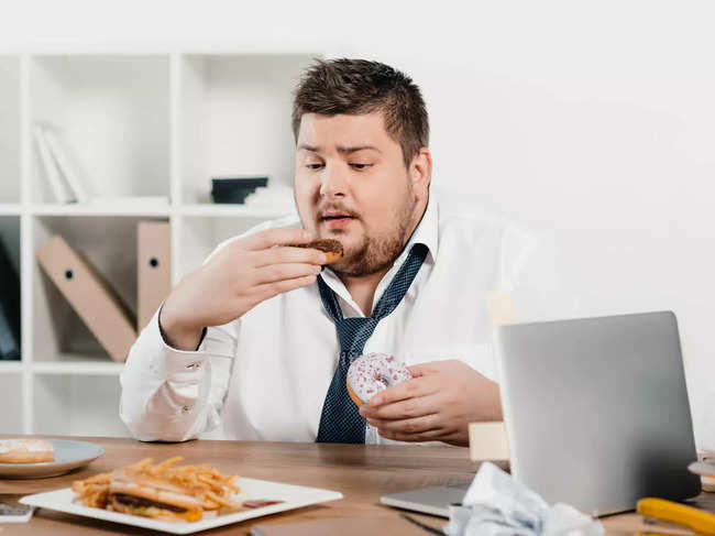 obesity-man-eating-junk-food_iStock