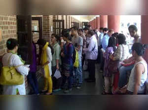 Delhi: Students arrive at a Delhi University college to submit their admission forms after the release of second cut off list at North Campus in Delhi on June 30, 2015. (Photo: IANS)