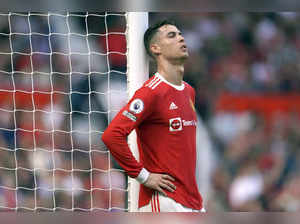 FILE- Manchester United's Cristiano Ronaldo rests against a goalpost during the ...