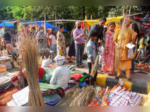 Patna: People buy brooms on the occasion of Dhanteras, in Patna. (PTI Photo)(...