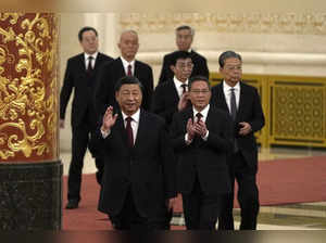 New members of the Politburo Standing Committee, front to back, President Xi Jin...