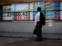 Asian stocks ease to 2-1/2-year lows, pound lifted by Sunak's victory