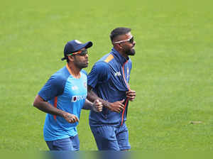 India's Hardik Pandya and Suryakumar Yadav take part in...