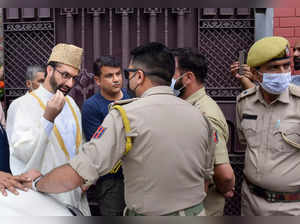 Srinagar: Hurriyat Conference Chairman Mirwaiz Umar Farooq speaks to police pers...