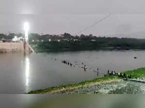 Morbi, Oct 30 (ANI): A cable bridge collapsed in the Machchhu river, in Morbi on...