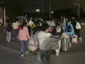 Workers leave iPhone factory in Zhengzhou amid COVID curbs