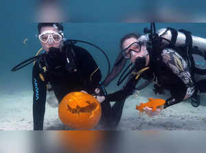 Scuba divers go 25-feet-deep into Florida Keys National Marine Sanctuary to carve pumpkins underwater in Halloween competition