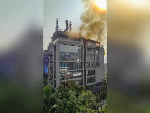 Pune: Smoke rises from a fire that broke out in a restaurant located on the top ...