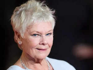 Dame Judi Dench fights back tears and recalls how she got home to be with her late husband Michael Williams before his death