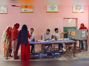 **EDS: IMAGE VIA HARYANA DPR** Kaithal: A woman casts her vote at a polling boot...