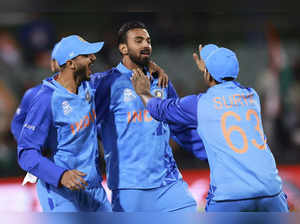 India's KL Rahul, centre, is congratulated by teammates after running out Bangla...