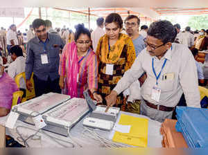 Jabalpur: Poll officials collect Electronic Voting Machines (EVM) and other elec...