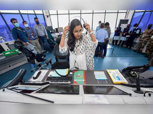 Chennai: A woman employee operates at the Air Traffic Control System on Internat...