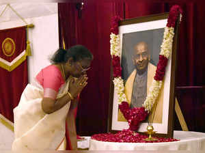 New Delhi, Oct 31 (ANI): President Droupadi Murmu pays homage to the portrait of...