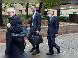 FILE PHOTO: Glencore's chairman Kalidas Madhavpeddi and Glencore's general counsel Shaun Teichner leave Southwark Crown Court in London