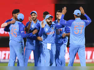 India's Virat Kohli gestures to teammate Deepak Hooda, right, following their T2...