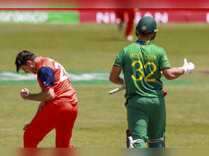 Netherlands' Brandon Glover, left, celebrates the wicket of South Africa's Rilee...