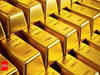 Gold retreats from three-week high as U.S. dollar stabilizes