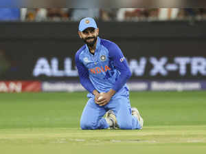 India's Virat Kohli reacts after taking a catch to dismiss Zimbabwe's Wesley Mad...